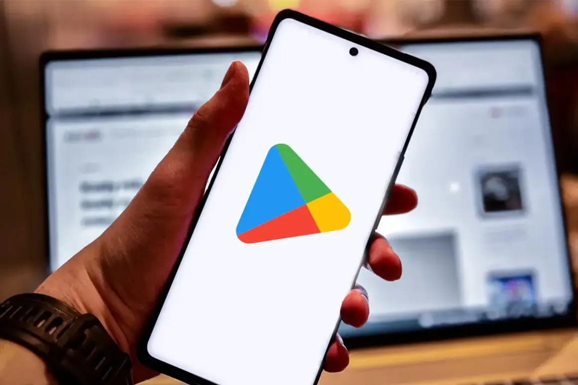 Smartfon z logo Sklepu Play. Dowiedz się, jak zainstalować Sklep Play na swoim urządzeniu, aby pobierać aplikacje.