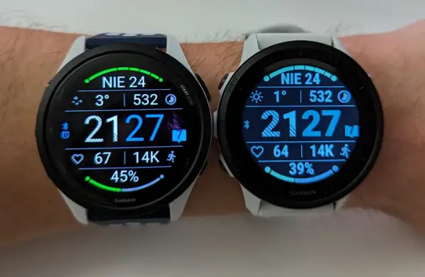 Dwa zegarki Garmin z wyświetlaczami AMOLED pokazują dane o aktywności: kroki, tętno, temperaturę i procent baterii.